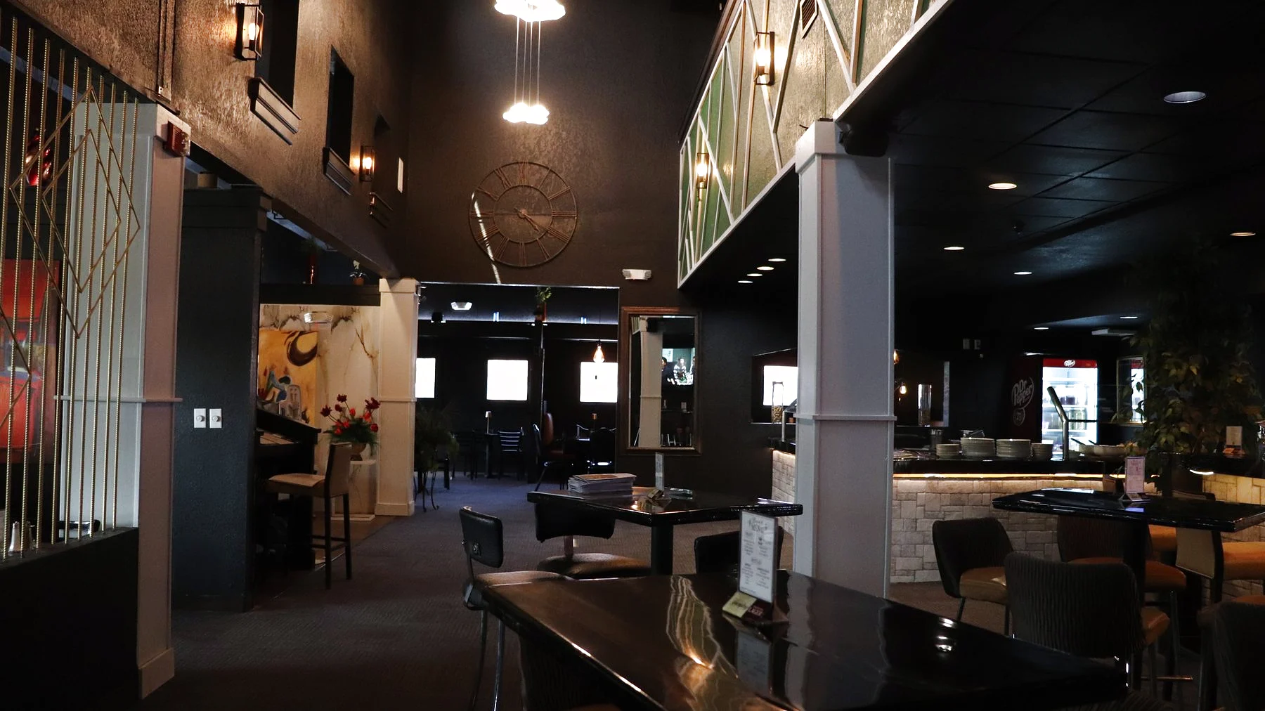 The elegant dining room at Melting Borders with warm ambient lighting